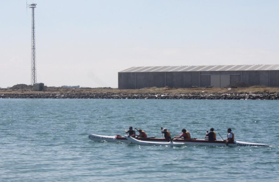 Oraka-Aparima Runaka navigate their waka ama in Bluff Harbour. Photo by Leeana Tamati.