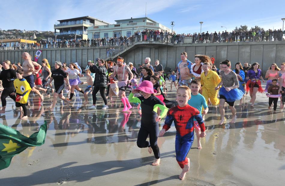 Eager participants charge towards the water.
