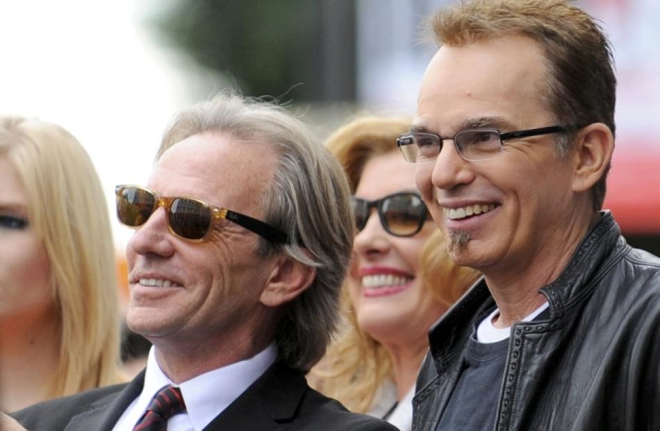 Musician Dewey Bunnell (L) and actor Billy Bob Thornton smile at fans as the Hollywood Chamber of...