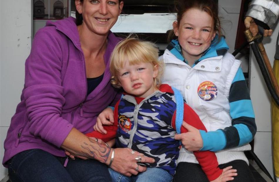 Susan, Quinn (2) and Jaymie (10) Cooper, of Dunedin at the Wings and Wheels show in Taieri...