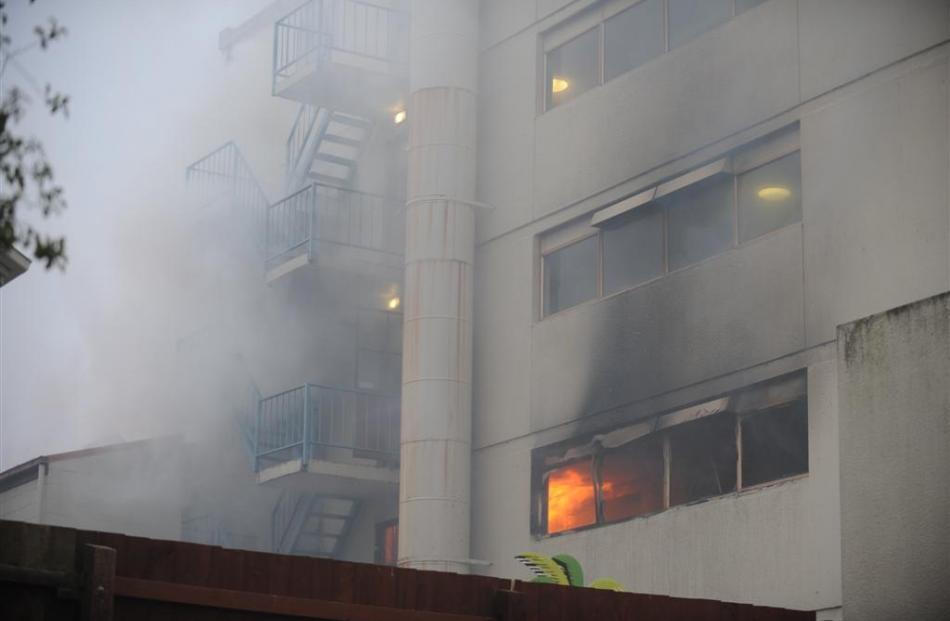 Smoke and flames from the fire. Photos by Stephen Jaquiery