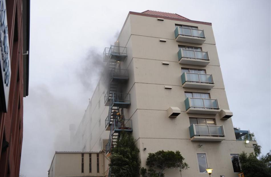 Smoke pours from the hotel. Photos by Stephen Jaquiery