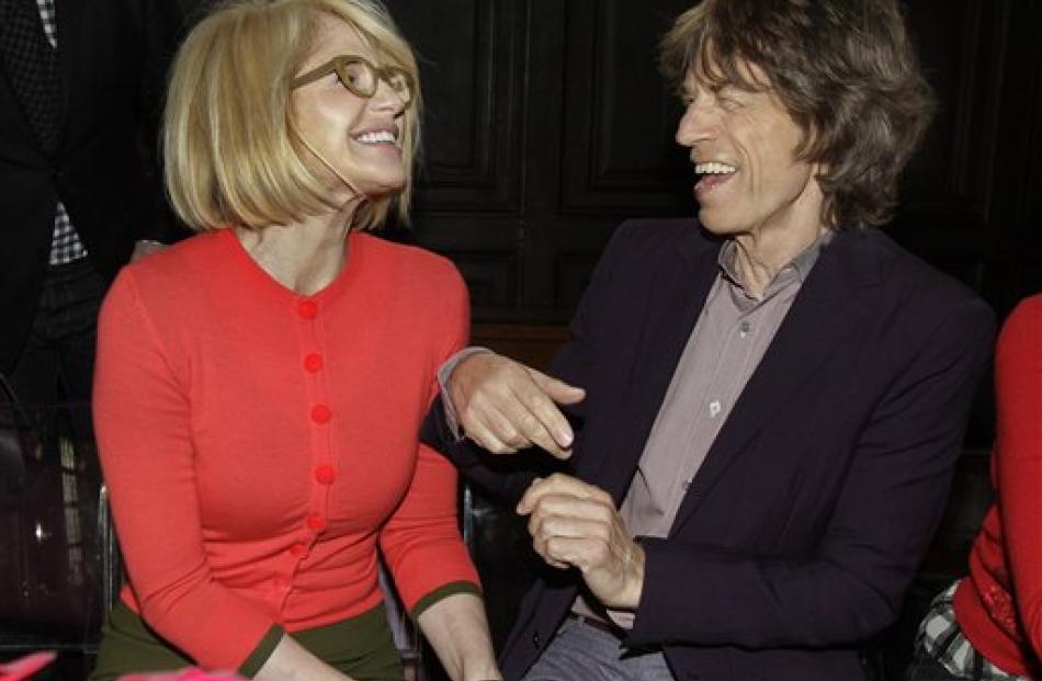 Actress Ellen Barkin, left, and Mick Jagger get together before the L’Wren Scott Fall 2012...