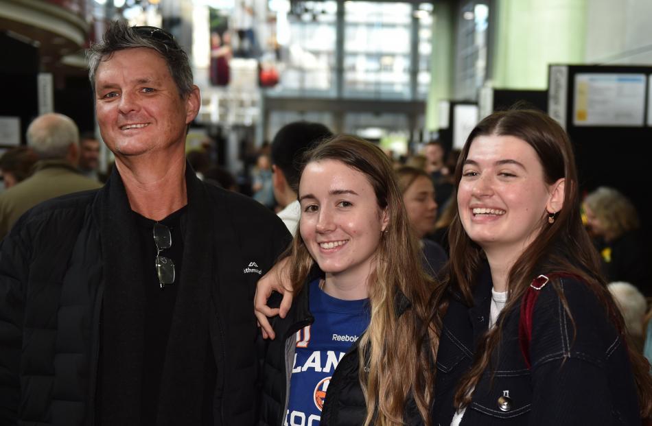 Shaun Molloy with his daughter, Alex Molloy (centre), and her friend, Natalie Simpson, who are...