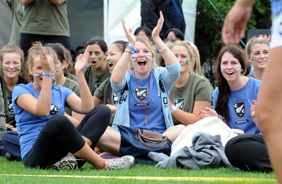 Cumberland College resident Tayla Fay (centre) cheers for her team-mates as they play volleyball...