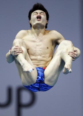 Qin Kai from China dives during the final of the Men's 3m Springboard at the FINA Diving World...