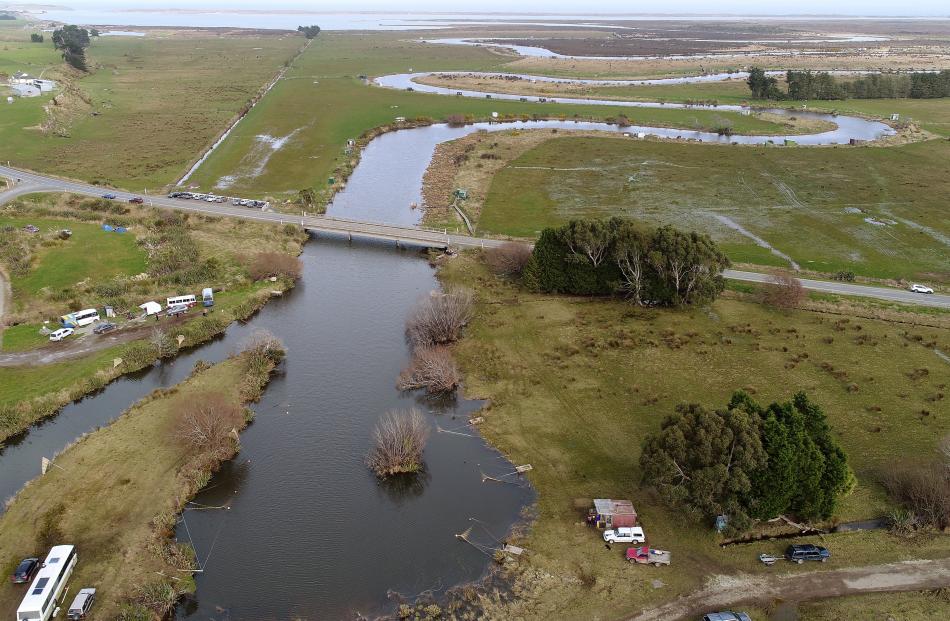 Dozens of whitebait huts and stands dot the Titiroa Stream near Fortrose in Southland.