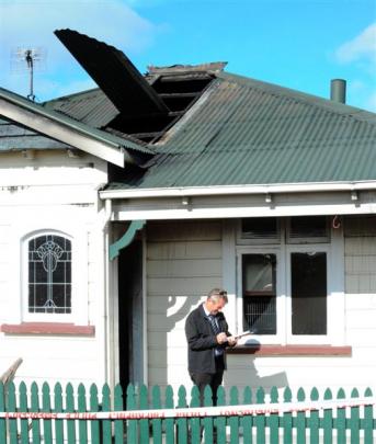 Detective Sergeant Brett Roberts at the scene  yesterday morning. Photo by Gerard O'Brien.