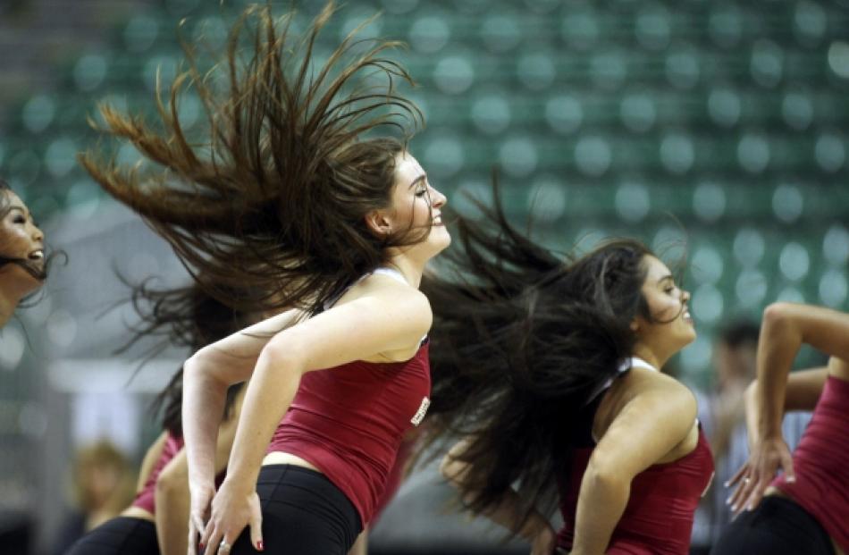 Members of a Santa Clara dance team perform during the West Coast Conference Championships...