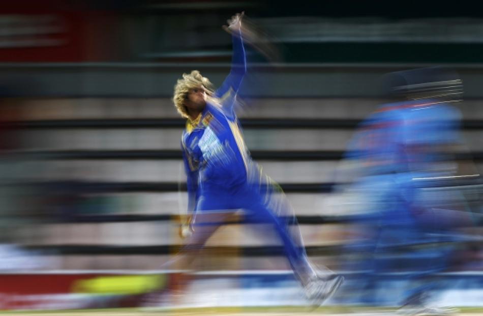 Sri Lanka's Lasith Malinga bowls during their Tri-series one-day international cricket match...