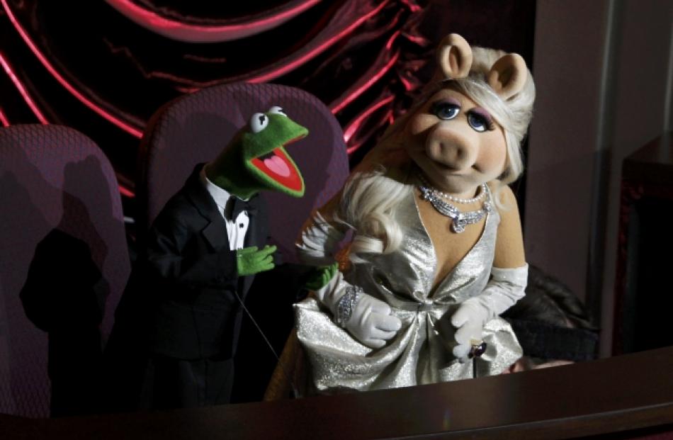 Muppet characters Miss Piggy and Kermit the Frog introduce a special performance by Cirque Du...