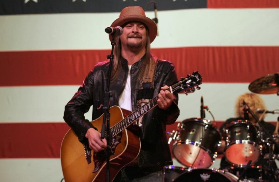 Musician Kid Rock performs during a campaign stop for US Republican presidential candidate Mitt...