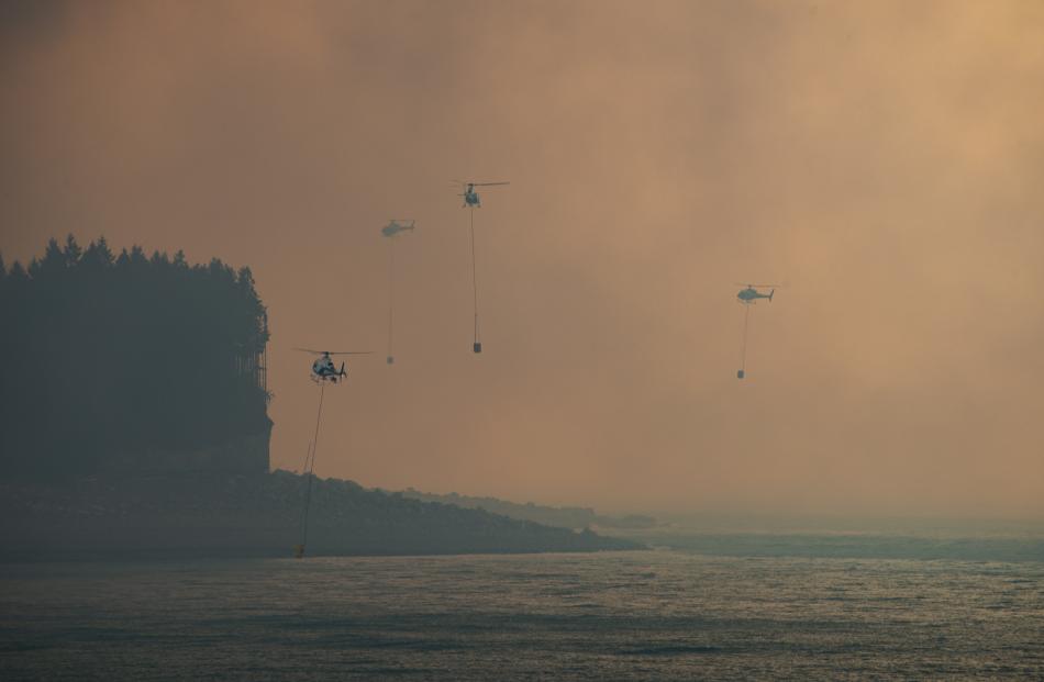 Helicopters fight the fire near Twizel. Photo: Murray Eskdale