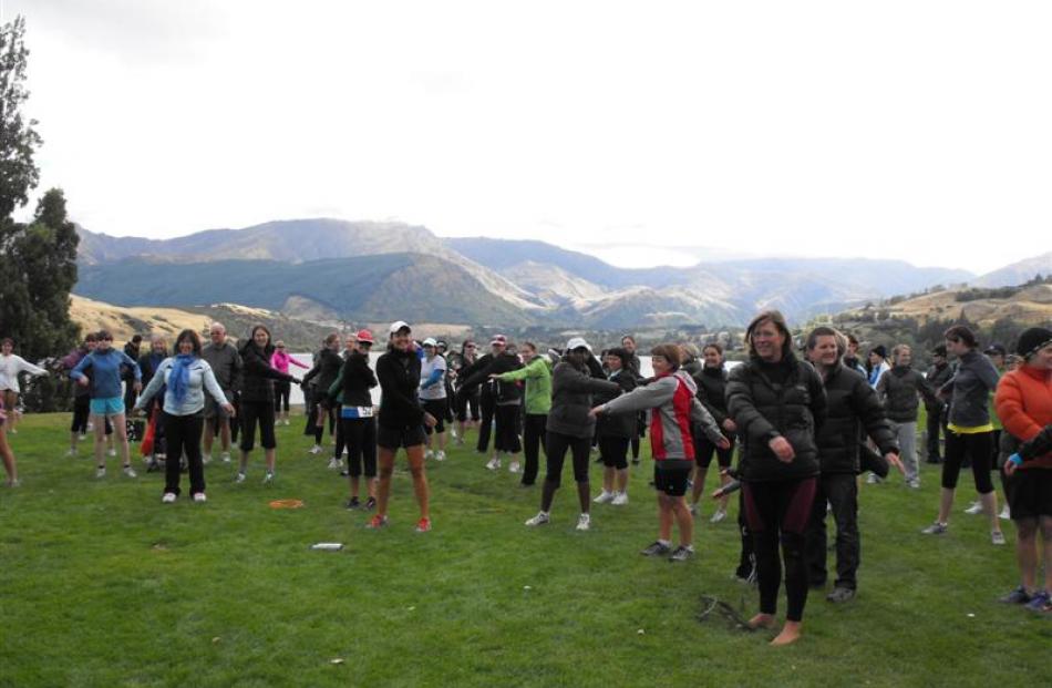 Competitors in the Fresh Choice Women's Triathlon on Saturday warming up in very chilly...