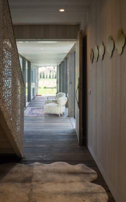 The custom-made balustrade on the stairs has a repeating pattern of hearts and deer heads.