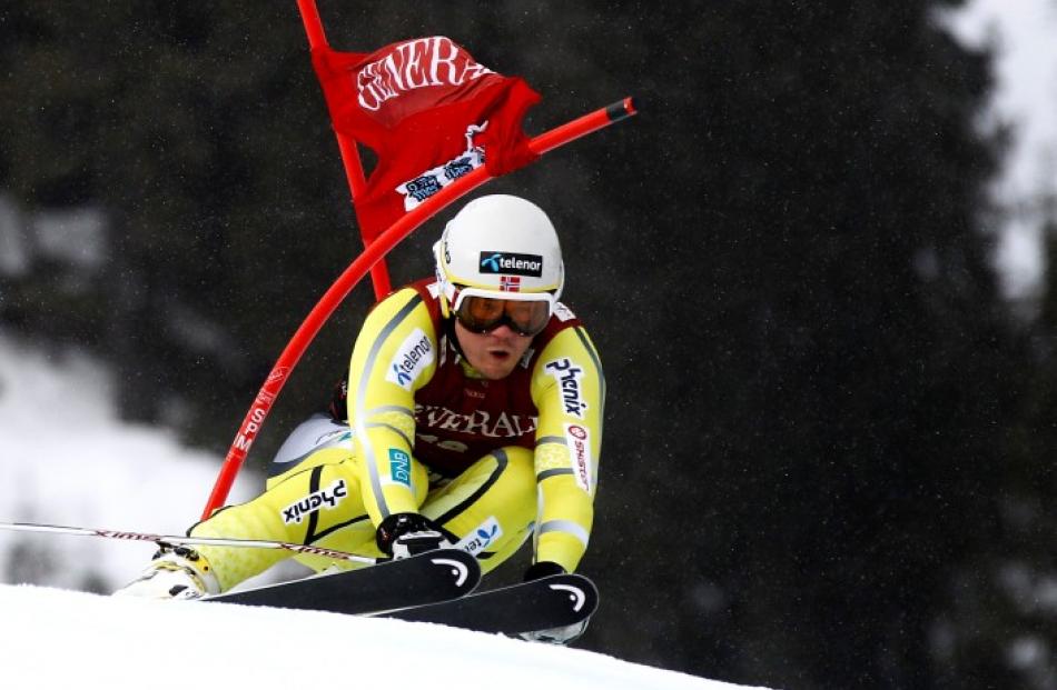 Norway's Kjetil Jansrud passes a gate on his way to winning the men's Alpine Skiing World Cup...