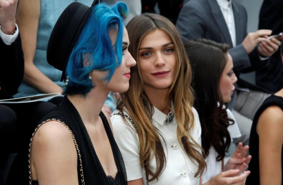 Singer Katy Perry (L) and French actress Elisa Sednaoui attend the Fall/Winter 2012-2013 show by...