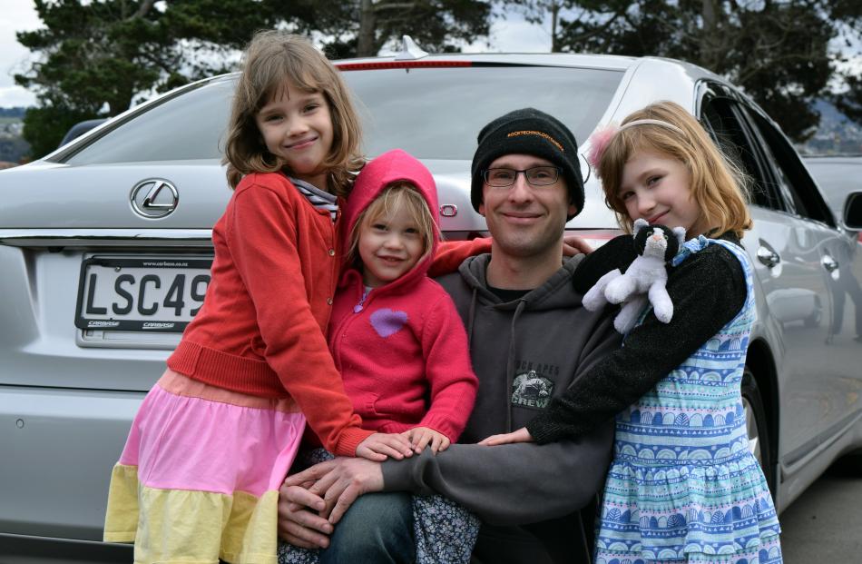 Chris Bay, of Mornington, and his daughters (from left) Charlotte (9), Maggie (2) and Michaela (7...