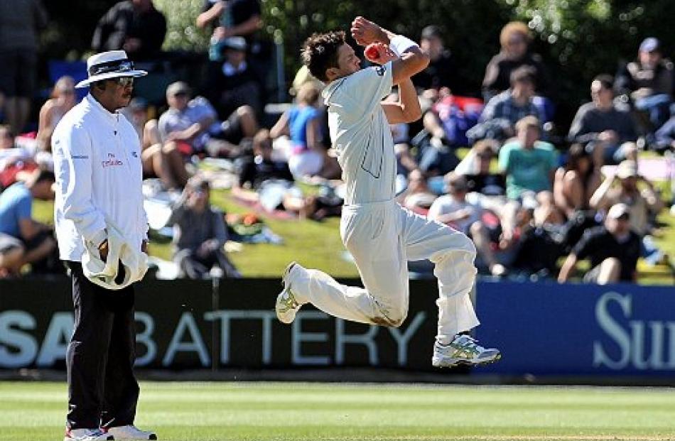 New Zealand bowler Trent Boult steams in. photo by Peter McIntosh