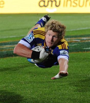 Flanker Adam Thomson scores a try against the Cheetahs at Carisbrook last year.