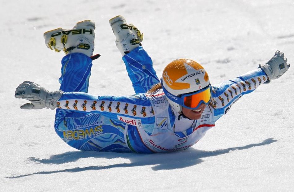 Anja Paerson of Sweden performs her traditional penguin after the women's Super G race at the...