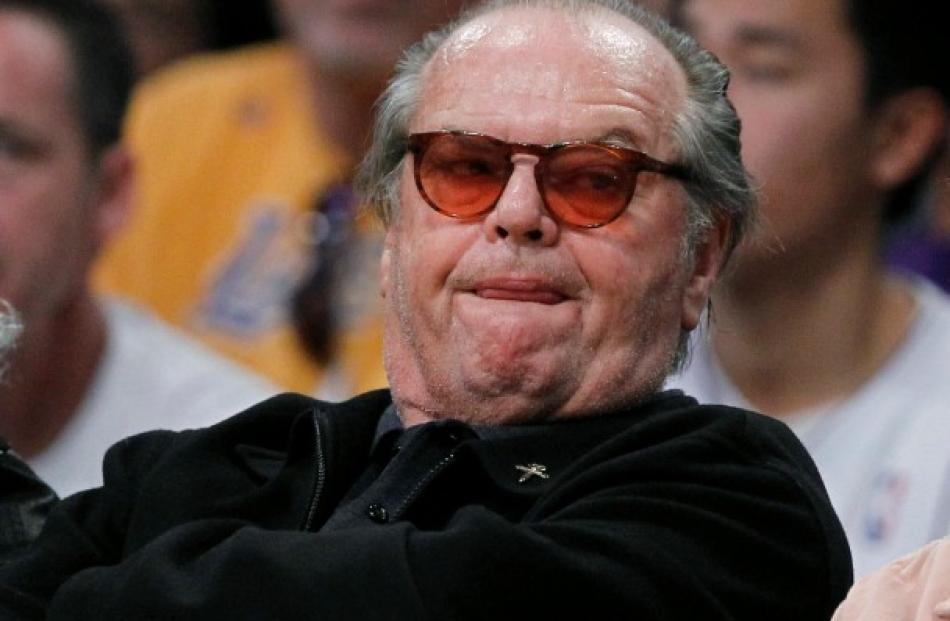 Actor Jack Nicholson watches the Boston Celtics play the Los Angeles Lakers during their NBA...
