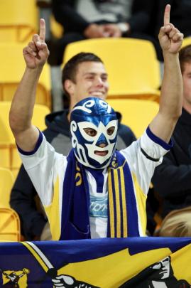 A Highlanders fan shows his support. (Photo by Hagen Hopkins/Getty Images)