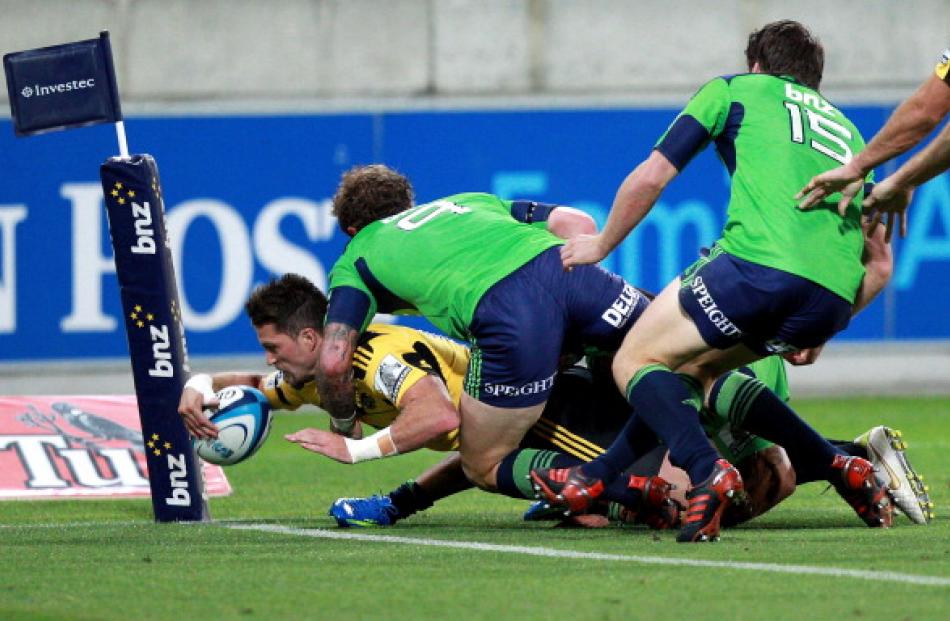 Cory Jane scores a try for the Hurricanes. (Photo by Hagen Hopkins/Getty Images)