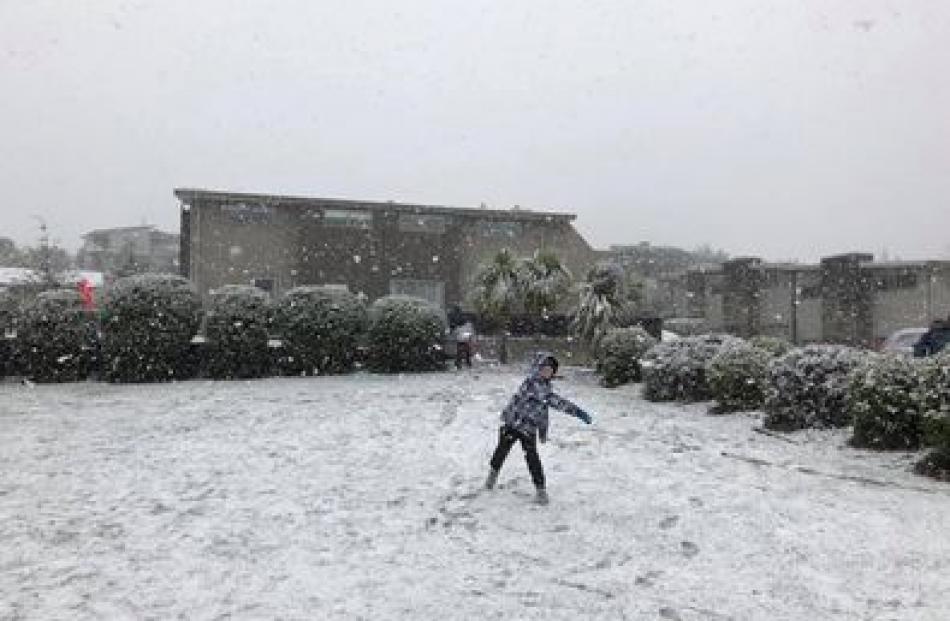 Liam Phipps hurls a snowball in Wanaka this morning. Photo: Brad Phipps 