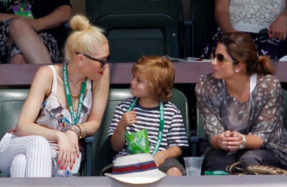 Singer Gwen Stefani (L), her son Kingston Rossdale and Mirka Federer attend the match between...
