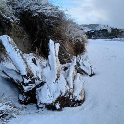 Even Brighton Beach had a dusting of snow this morning. Photo: Zoe Armstrong