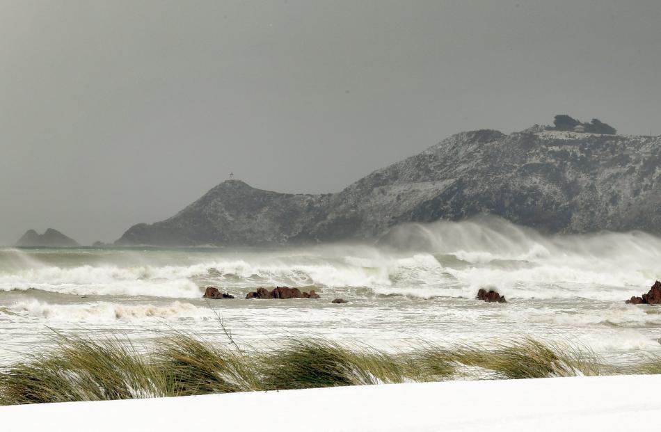 Gale-force winds whip waves below the Nugget Point Lighthouse, in the Catlins. 