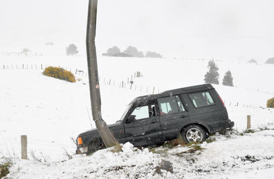 A power pole bore the brunt of a 4WD whose driver lost control in the icy conditions on the Owaka...