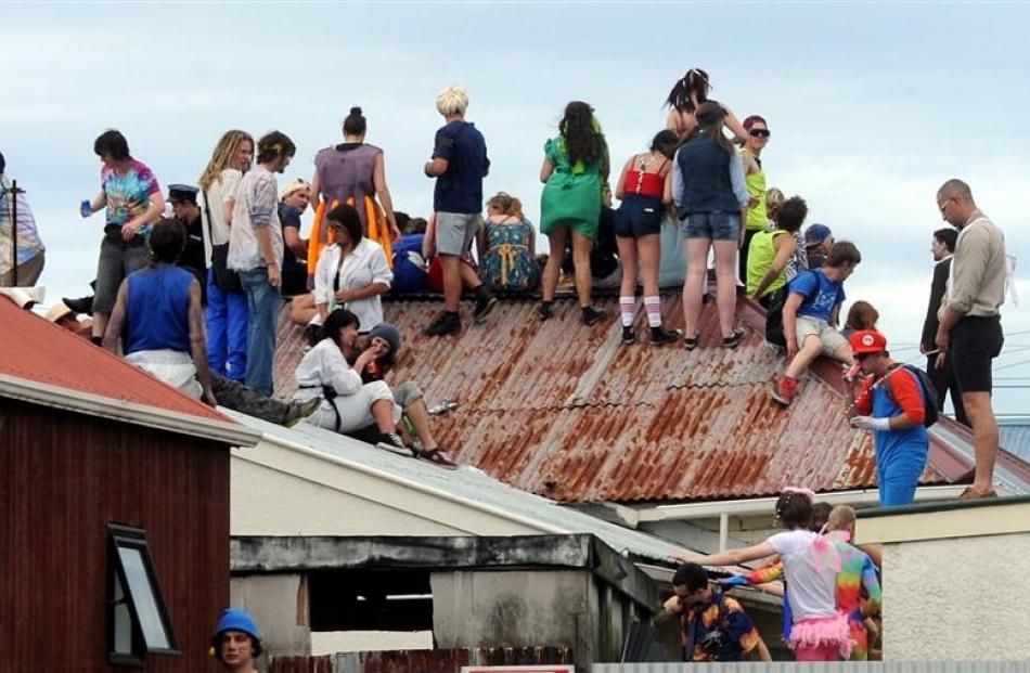 Revellers on the roof of John Leslie's property, part of which later collapsed.