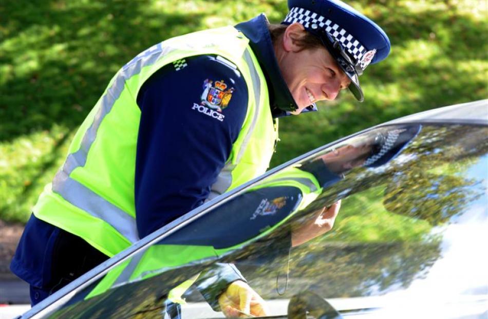 Police officers check on traffic and motorists' behaviour yesterday on Princes St.