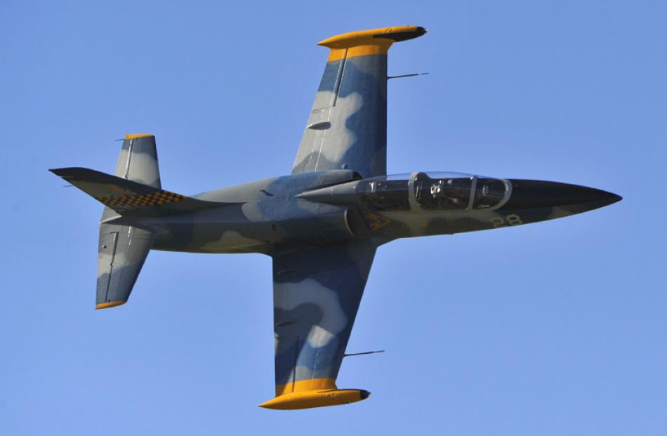 The Albatross L39, flown by Frank Parker, buzzes the runway at speed during Warbirds over Wanaka...