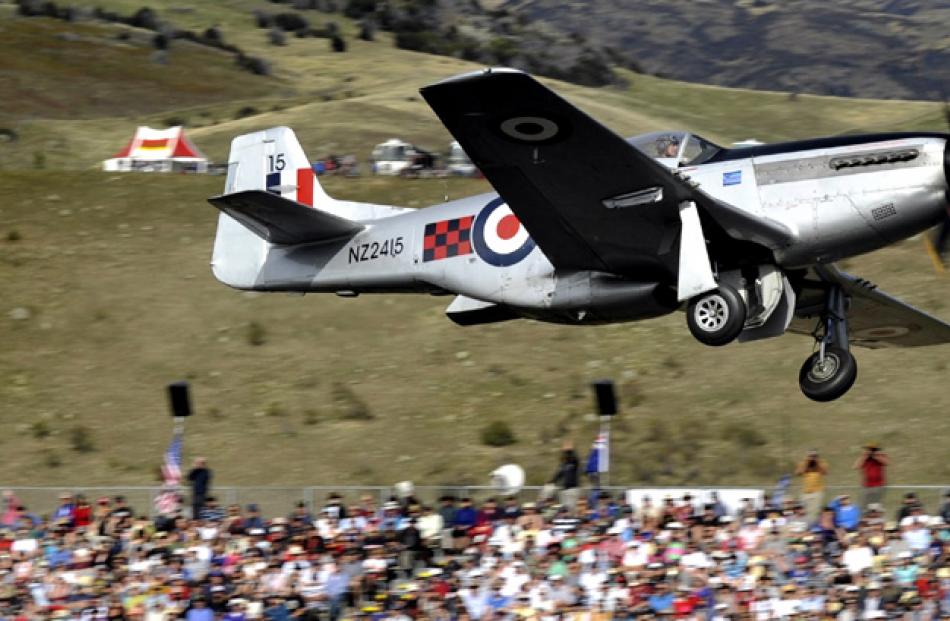 A P51 Mustang, flown by Graham Bethell takes off during Warbirds over Wanaka on Sunday morning.