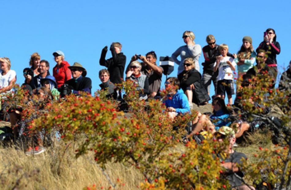 The large crowd gather on top of Mt Iron wANAKA to view the brand new Allblack Boeing B777 on...