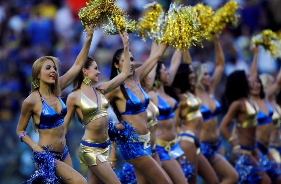 Boca Juniors' cheerleaders perform during halftime of their Argentine First Division football...