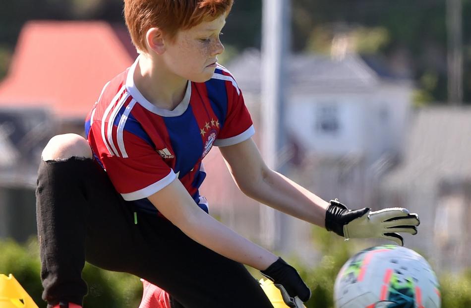 Louie Moffat (9) gets his body behind the ball