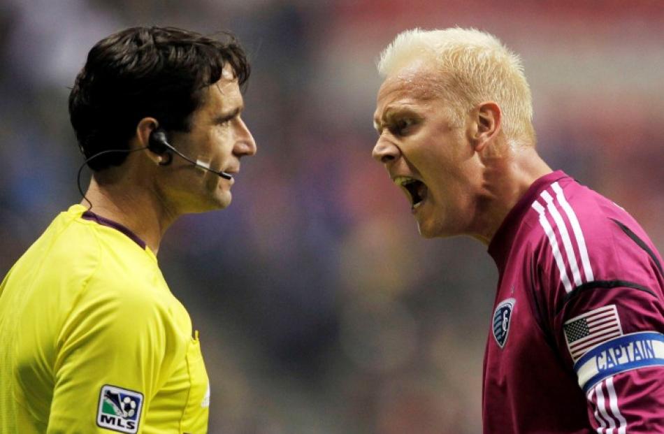 Sporting KC goalkeeper Jimmy Nielsen yells at the referee after a goal was scored by the...