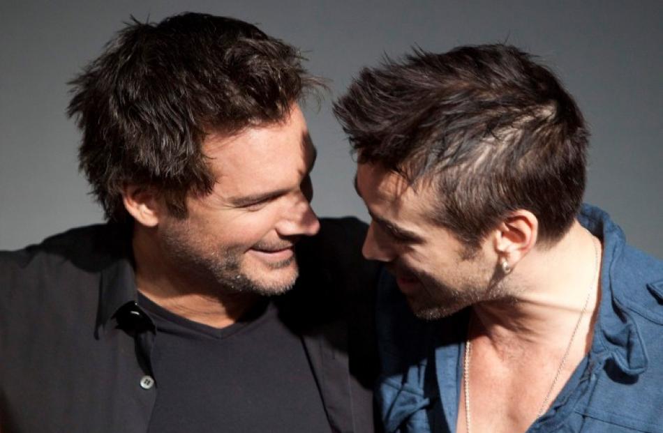 Director Len Wiseman (L) and cast member Colin Farrell talk during the launch of their film ...