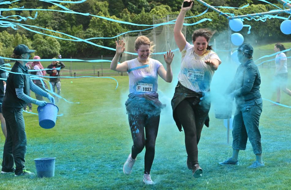Kate Gidlow-Black (left) and Ruby Faragher run through a paint station. PHOTOS: LINDA ROBERTSON
