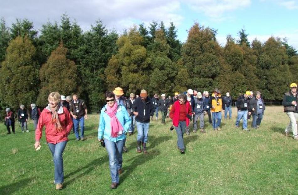 Some of those attending  the conference after viewing a stand of Douglas fir on Verterburn.