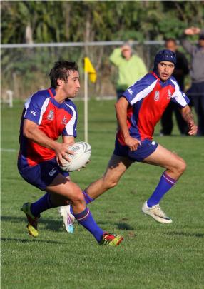 Harbour captain and halfback Johnny Legg looks to set the backline free, early in the second half...