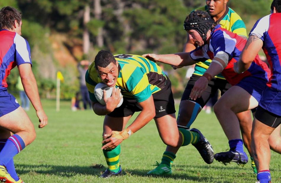 Mika Mafi tries to stay on his feet against Harbour at Watson Park.