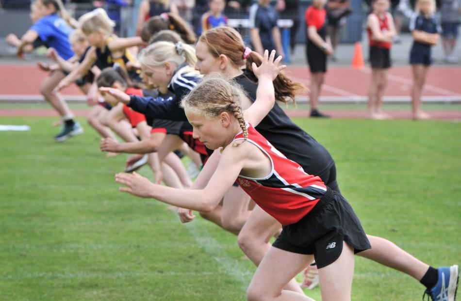 Sylvie Haig (10), of Fairfield School, takes off from the start line of the girls under-10 60m...