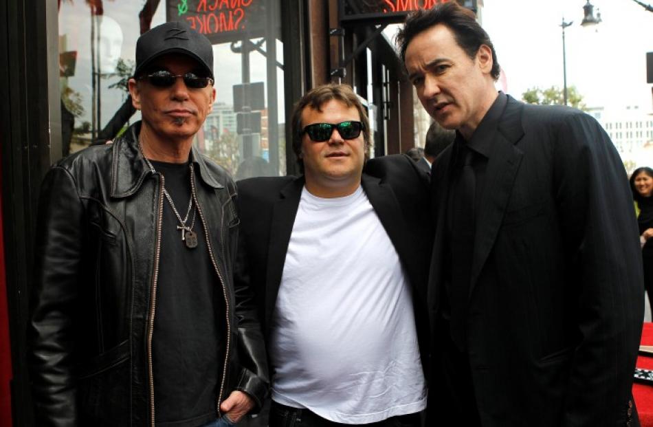 Actor John Cusack (R) poses with actors Jack Black (C) and Billy Bob Thornton after his star was...