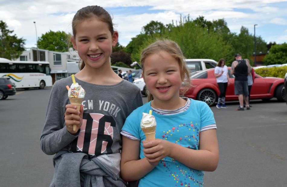 Sisters Lily (9) and Tia (6) Te Ngahue, of Belleknowes, eat ice cream.

