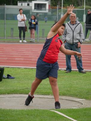 Silverstream School pupil Stanley Vatuvei (10) launches the shot into the field.